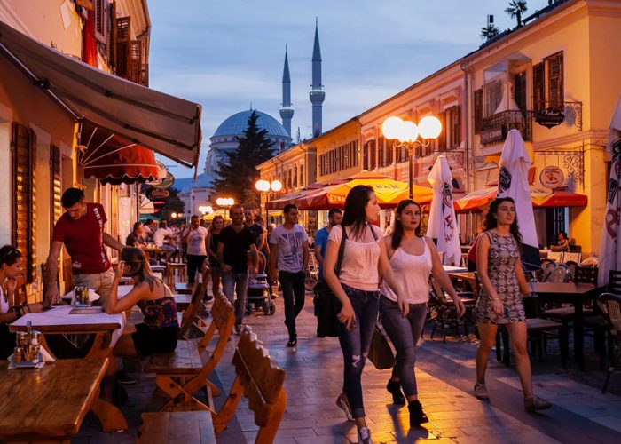 People walking down the pedestrianised street in Shkoder Albania in the evening