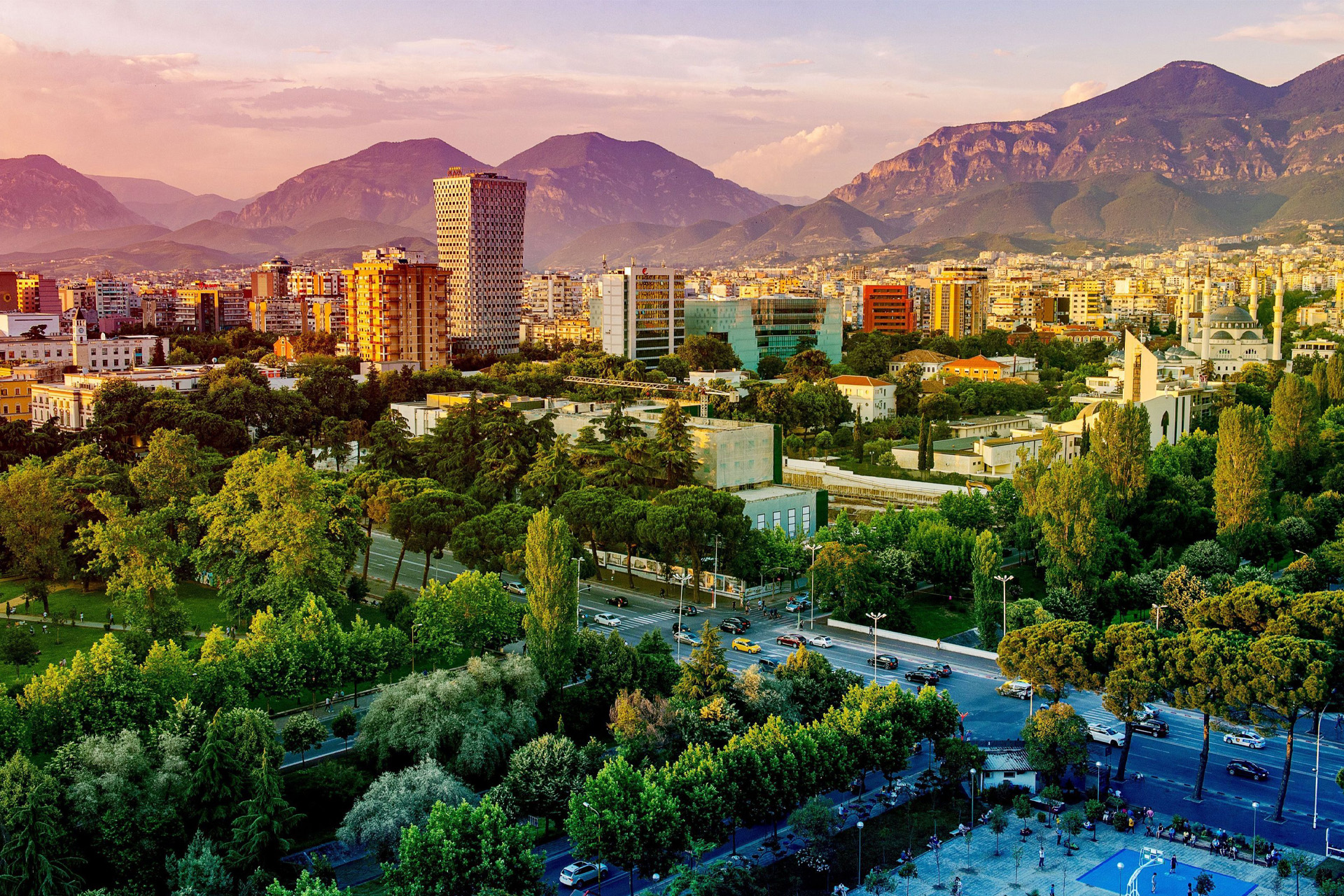 An aerial view over Tirana with Mount Dajti in the background
