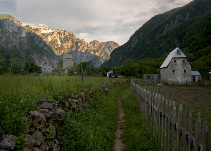 Iconic image of Theth with mountains in the background